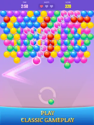 Gameplay of Bubble Cash. Pink Bubble earning points by colliding with large group of pink bubbles.